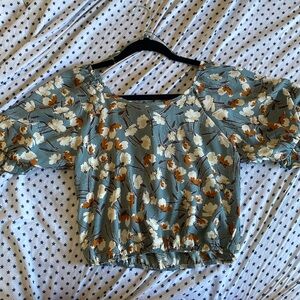 Cute floral backless top . Nice blue with flowers